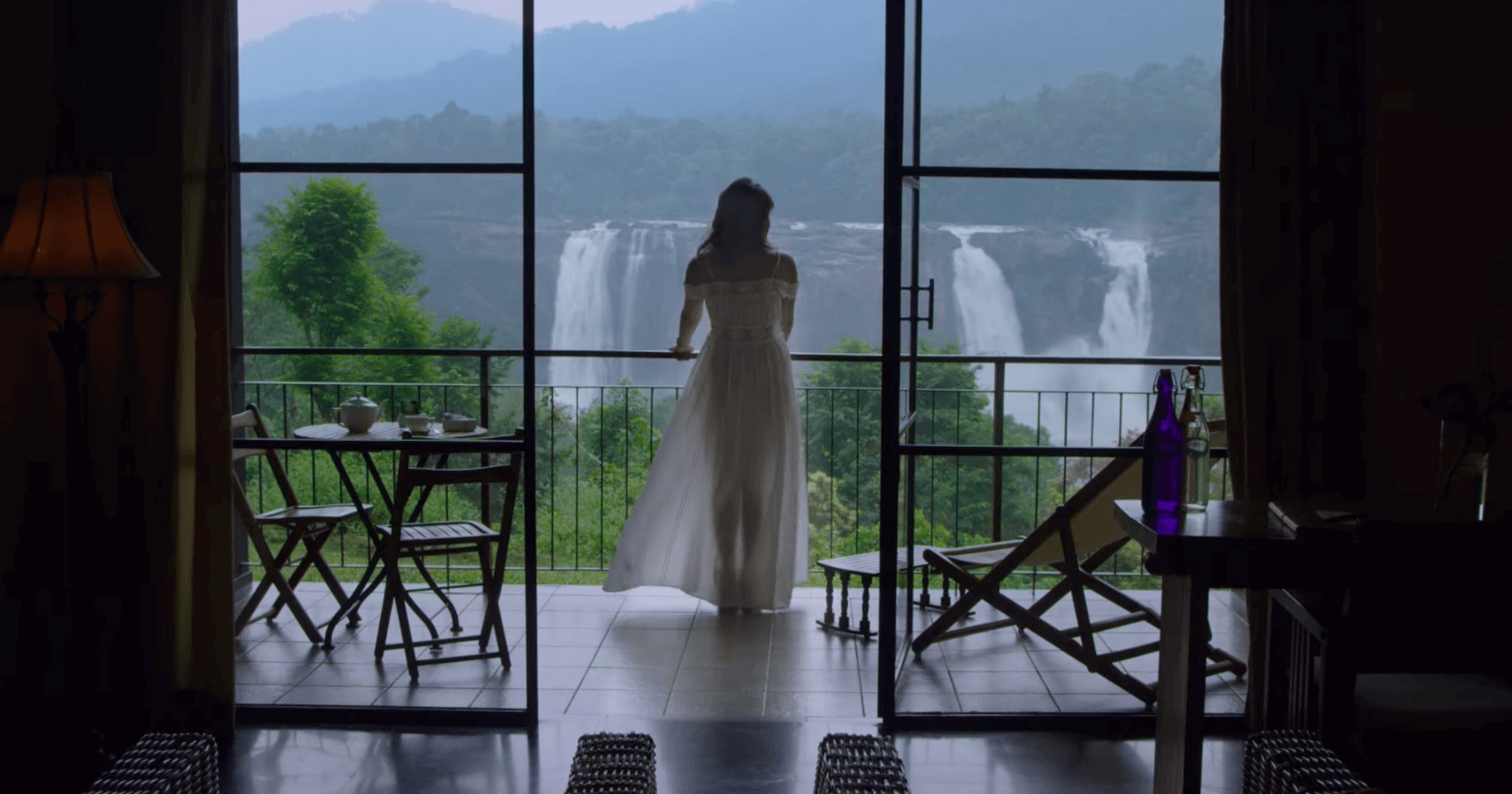 Woman watching the waterfalls from the balcony