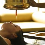 A woman experiencing authentic ayurvedic treatment
