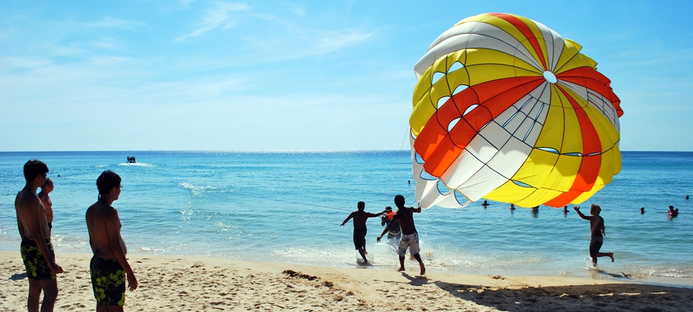 Traveler all set for parasailing at a beach in kerala