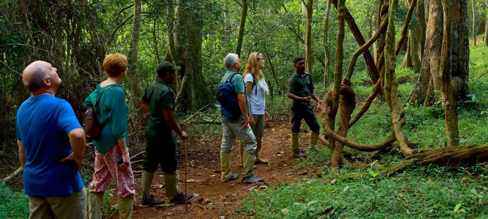 Travelers listening to their guide during border hiking