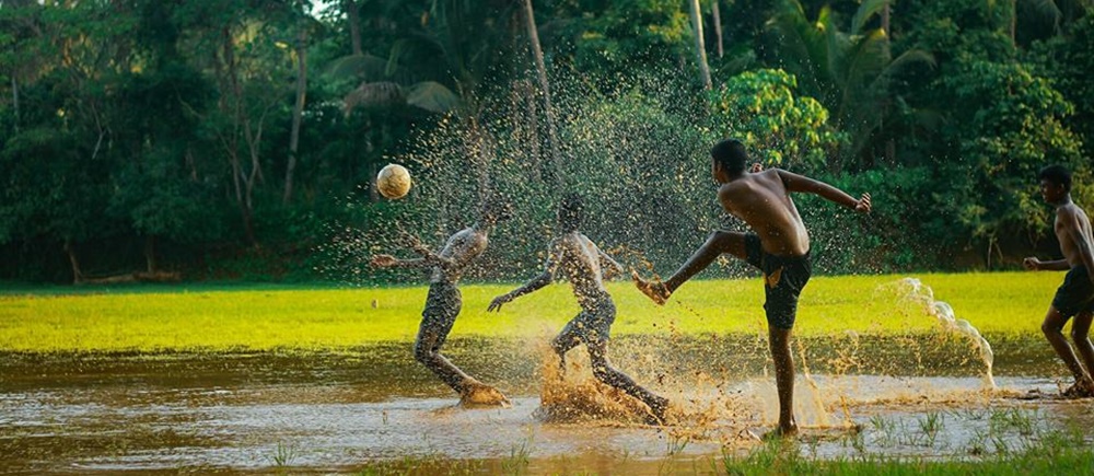 Village children playing football