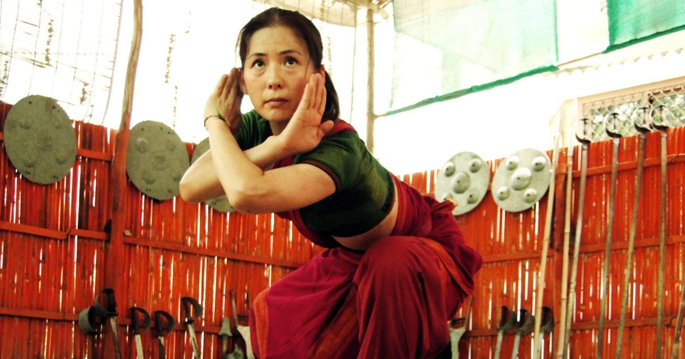 A foreign woman practicing kalaripayattu