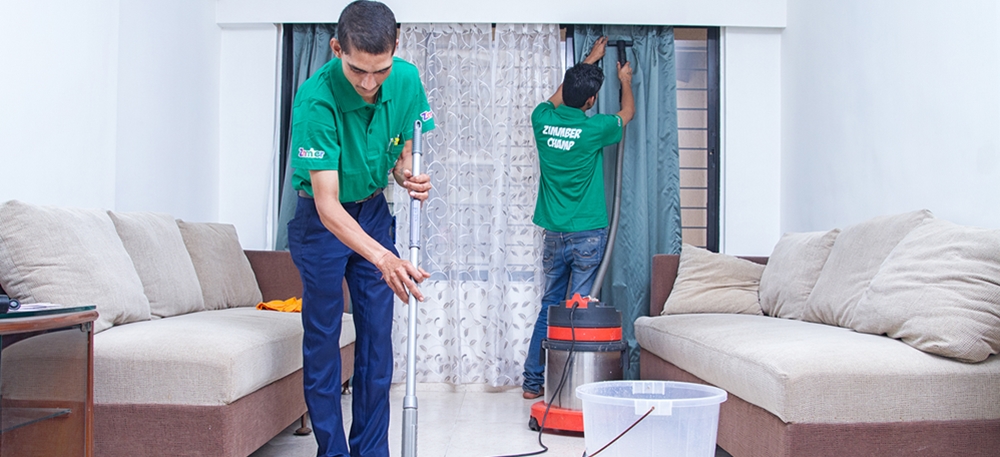 Housekeeping staff cleaning the hotel room