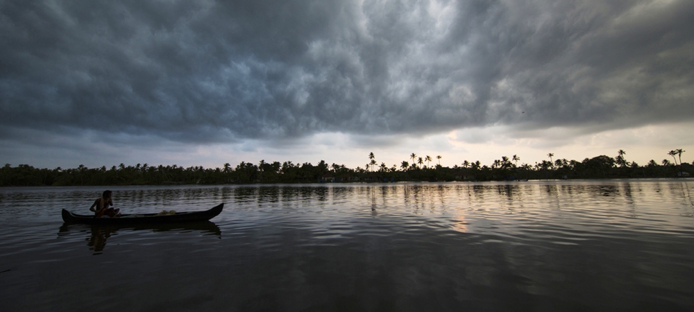 Thick dark clouds begin to cover the sky above the backwaters