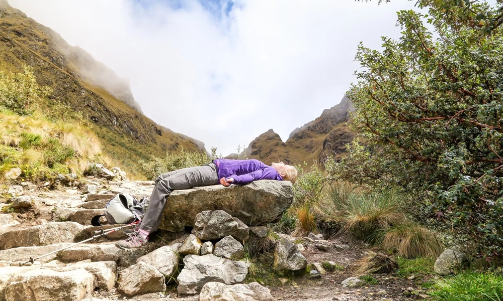 Women experiencing altitude sickness on a mountain
