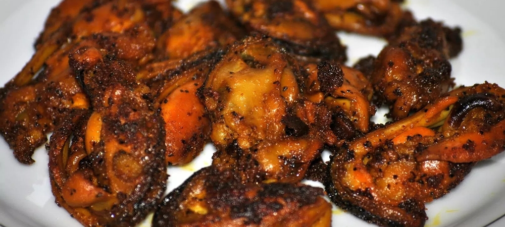 Spicy Mussel Fry served on a plate