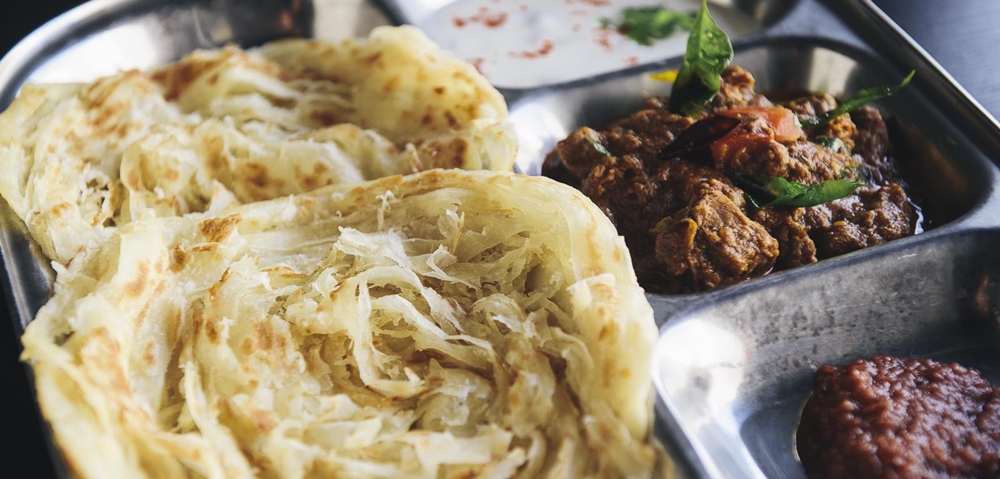 A plate of parotta with spicy beef fry