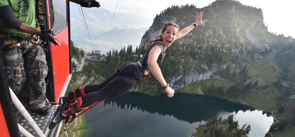 Woman screaming with joy as she jumps