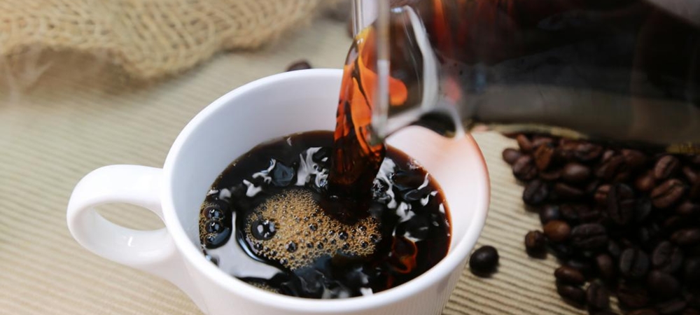 Pouring coffee in a cup