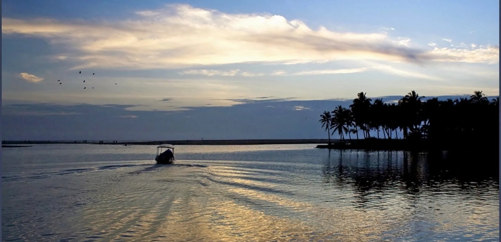 Boating during sunset at Payyambalam Beach