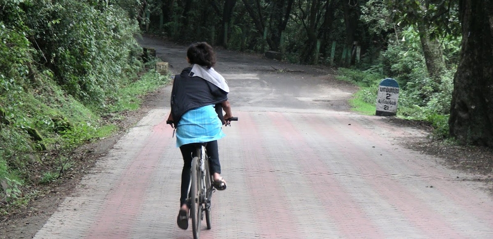 A woman enjoy a bicycle ride