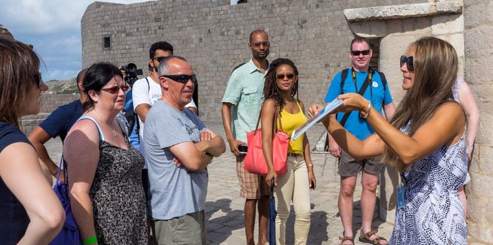 Tour guide giving information through pictures