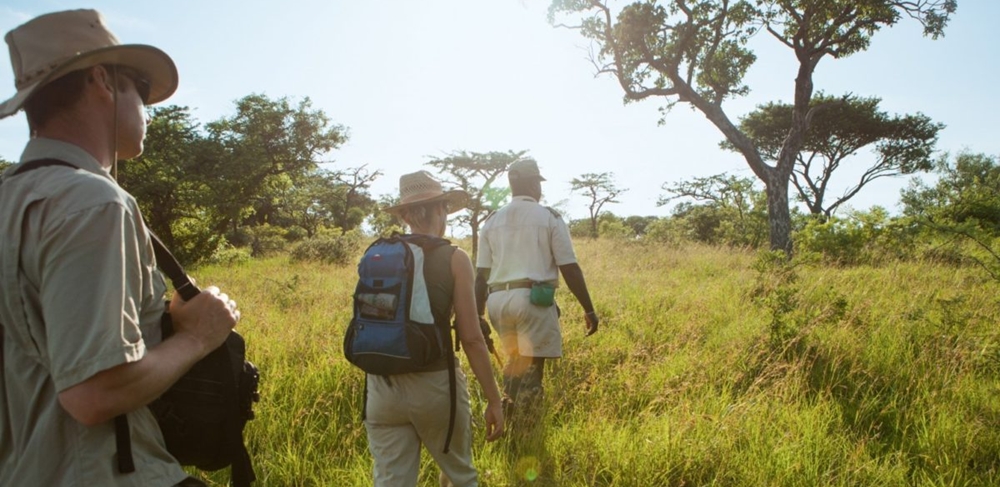 Tour guide making travelers try something new