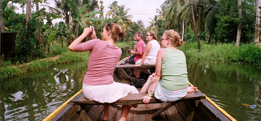 Family enjoying a canoe ride in the Kerala backwaters