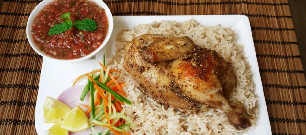 Arabian delicacy - Chicken Mandi with sauce and salad