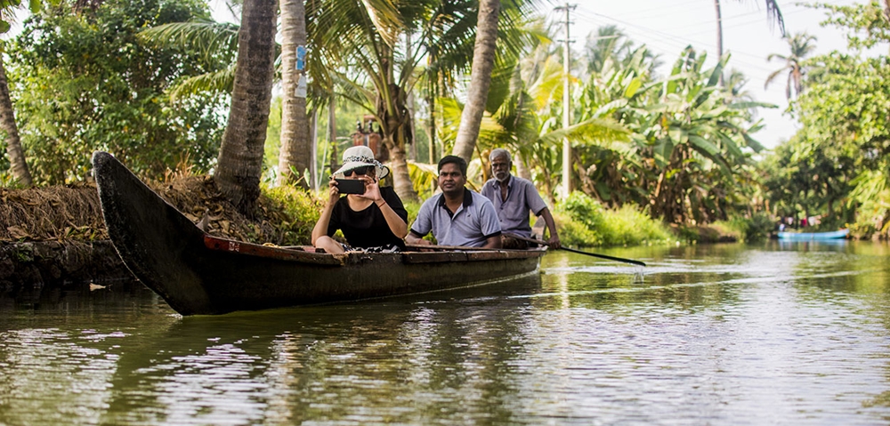 Tourist on a Kerala canoe