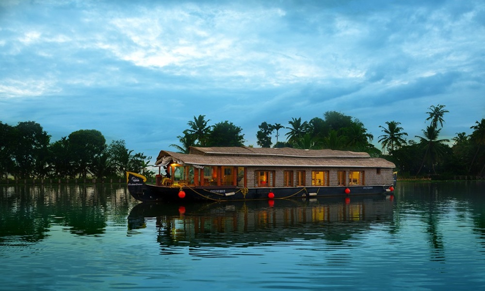 Houseboat cruising through scenic backwaters